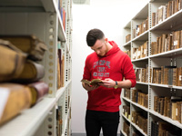 Student reading book in library